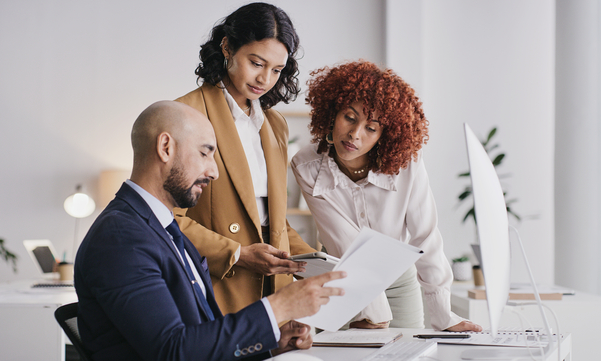 three people in a meeting