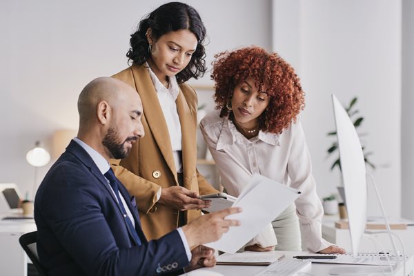 three people in a meeting