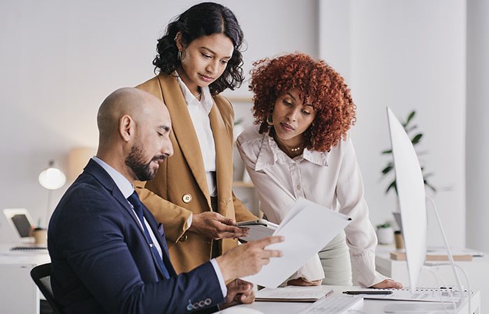 three people in a meeting